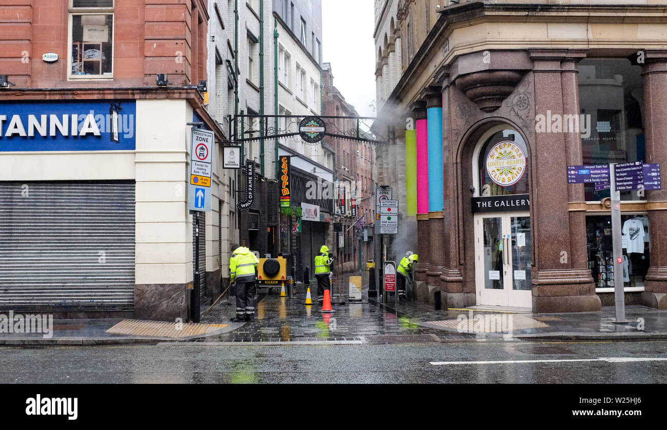 Liverpool Merseyside UK Street cleaners at work in the Mathew Street