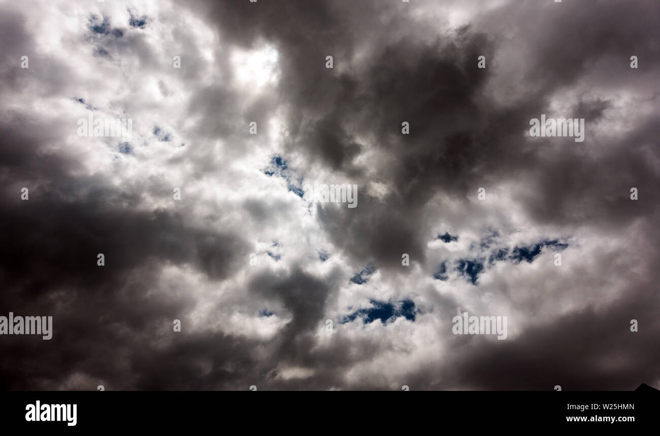 Dark and Dramatic Storm Clouds Area Background Stock Photo