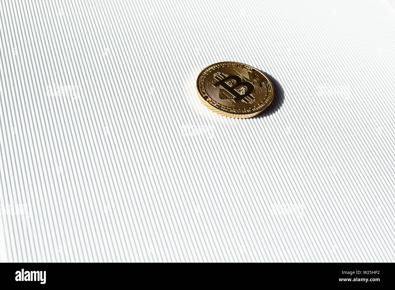 Gold coin with a bitcoin symbol on white background. Concept of finance in internet. Virtual crypto currency. Stock Photo