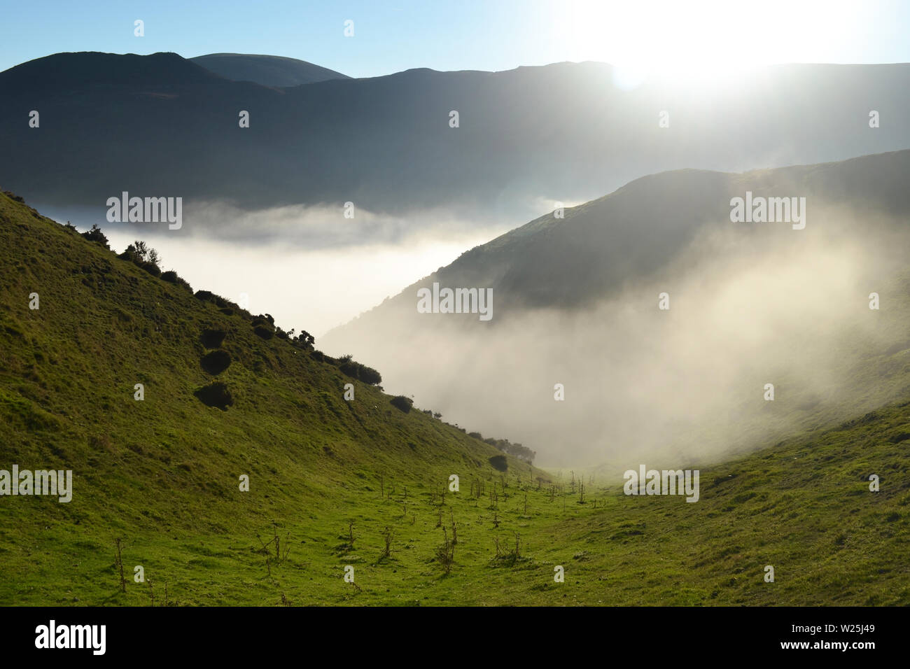 View of the Shropshire Hills from the Long Mynd, with clouds in the valley. Above the clouds, looking down. UK Stock Photo