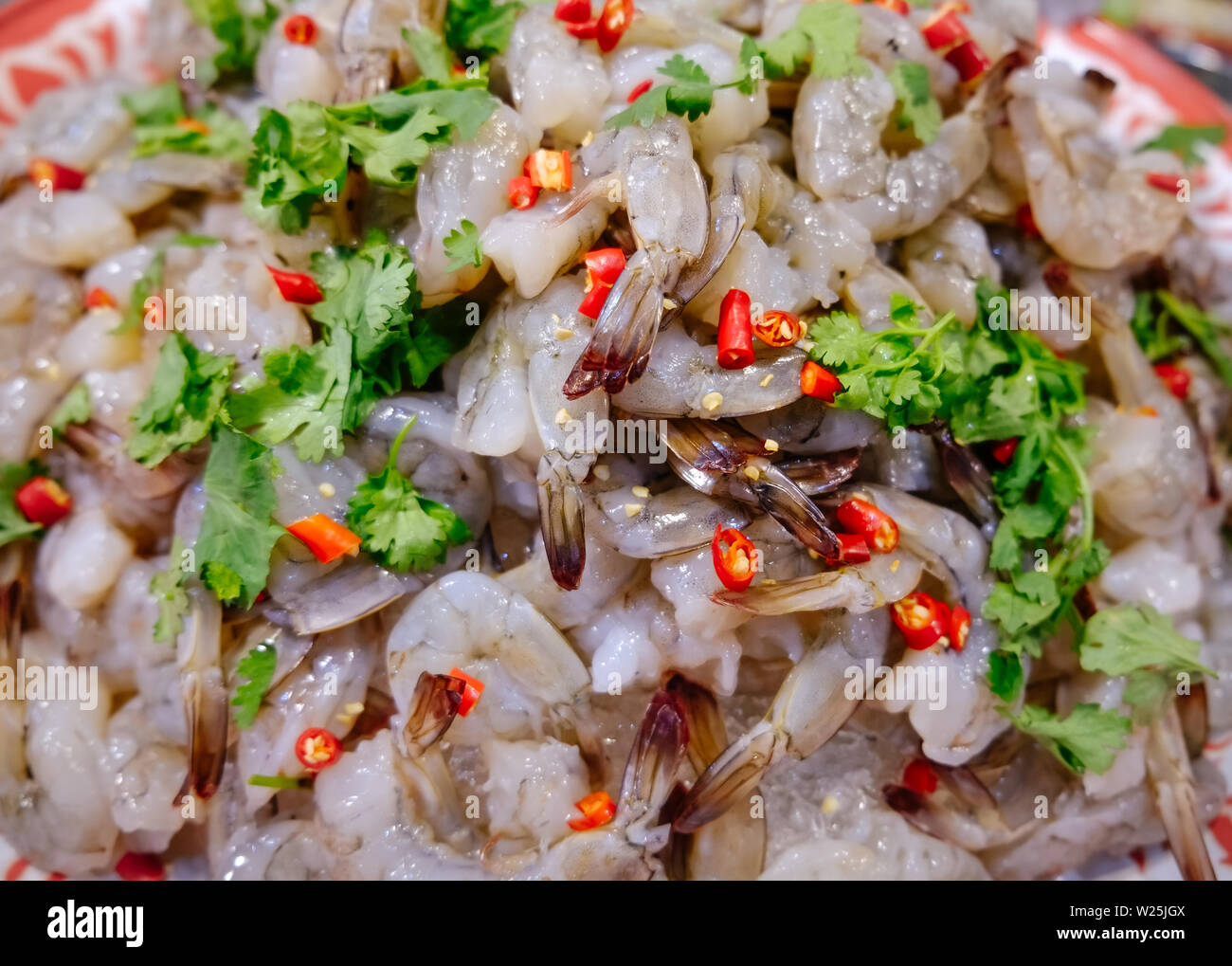 Pile of raw spicy and sour shrimp for sale in a local fresh market in Bangkok, Thailand. Ready to eat food. Stock Photo