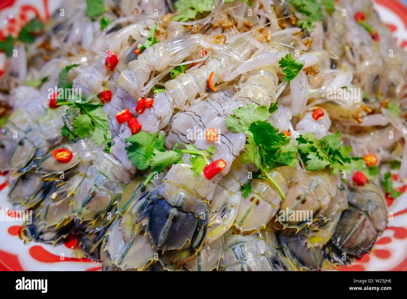 Pile of raw spicy and sour mantis shrimp for sale in a local fresh market in Bangkok, Thailand. Ready to eat food. Stock Photo