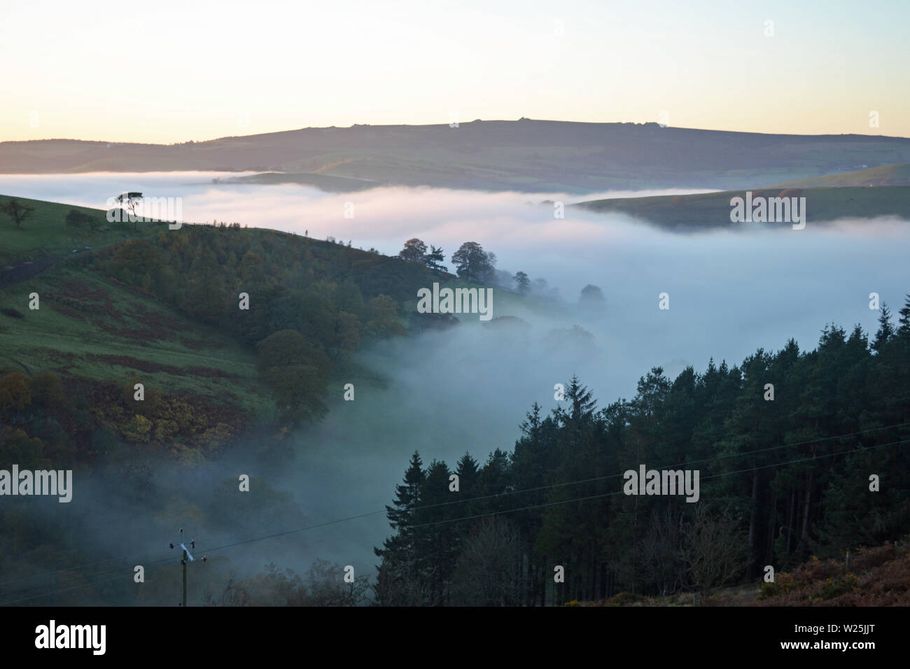 View of the Shropshire Hills from the Long Mynd, with clouds in the valley. Above the clouds, looking down. UK Stock Photo