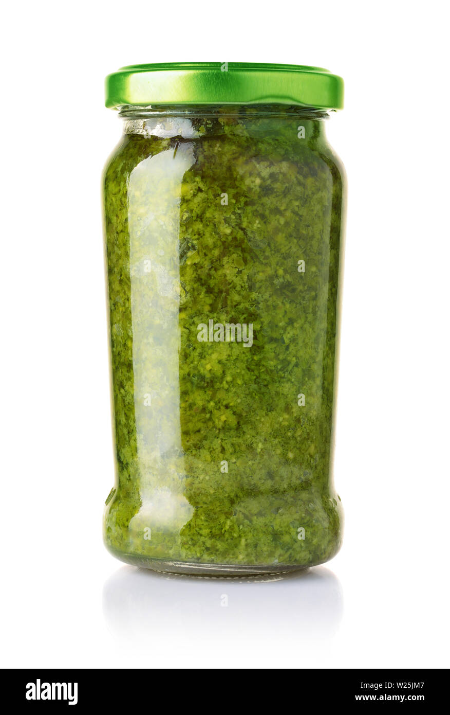 Glass jar of pesto sauce isolated on the Stock Photo