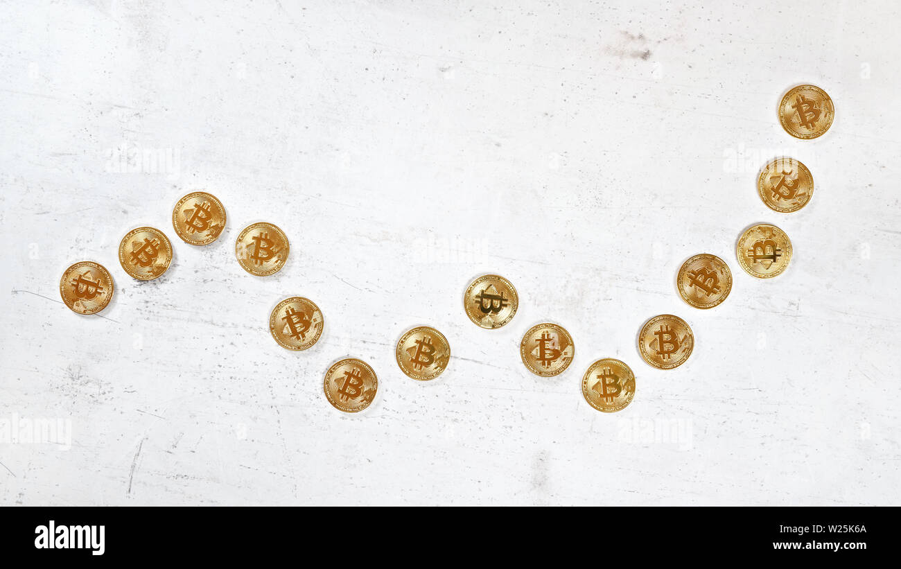 Top down view, white stone board desk with golden bitcoin coins in shape of  rising graph - bullish cryptocurrency market illustration Stock Photo -  Alamy