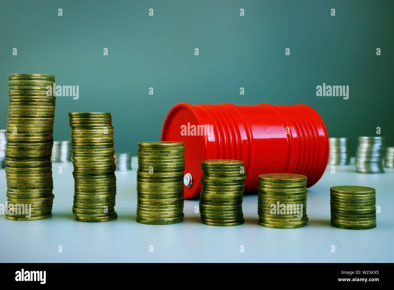 Oil price drop. Red barrel and money. Stock Photo