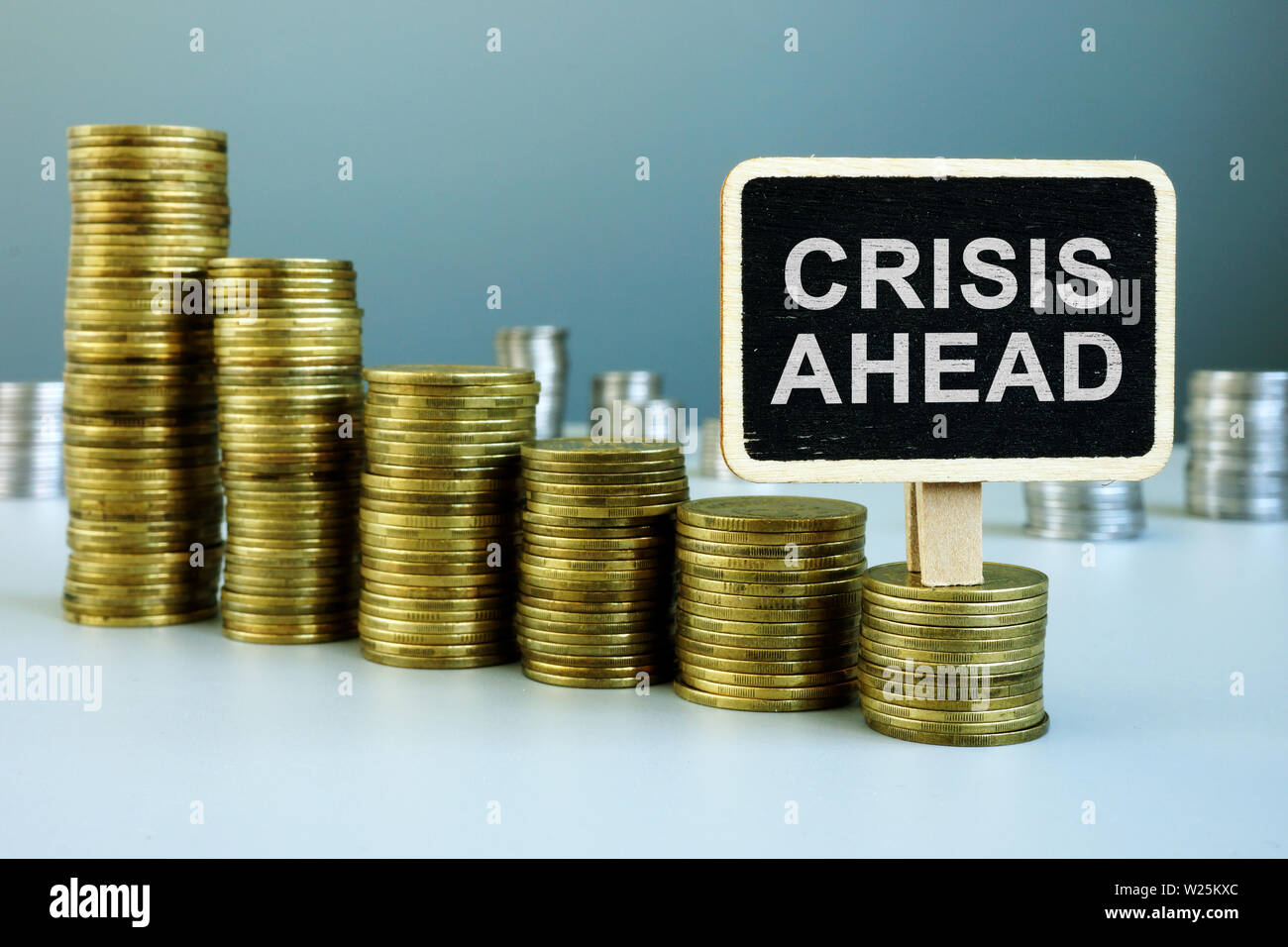 Crisis ahead concept. Financial chart from coins. Stock Photo