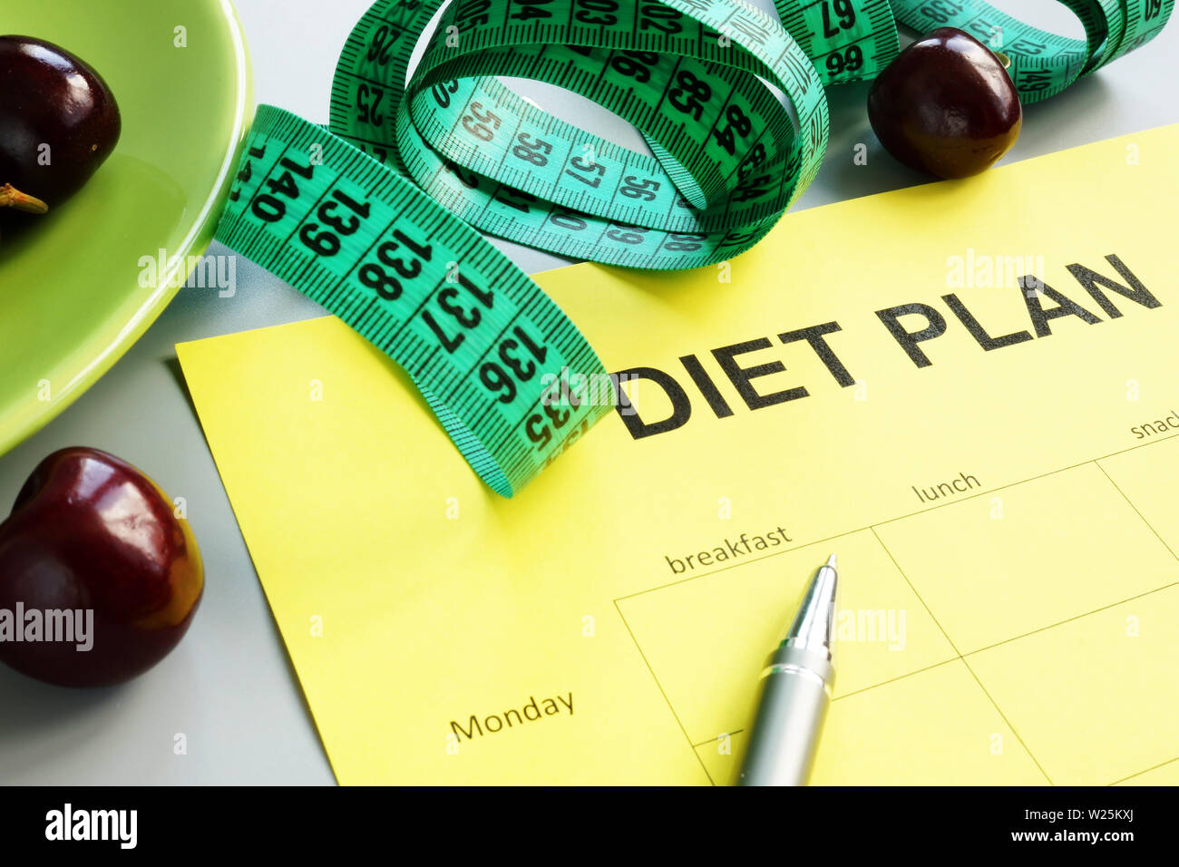 Diet plan blank for weight loss and cherries Stock Photo Alamy