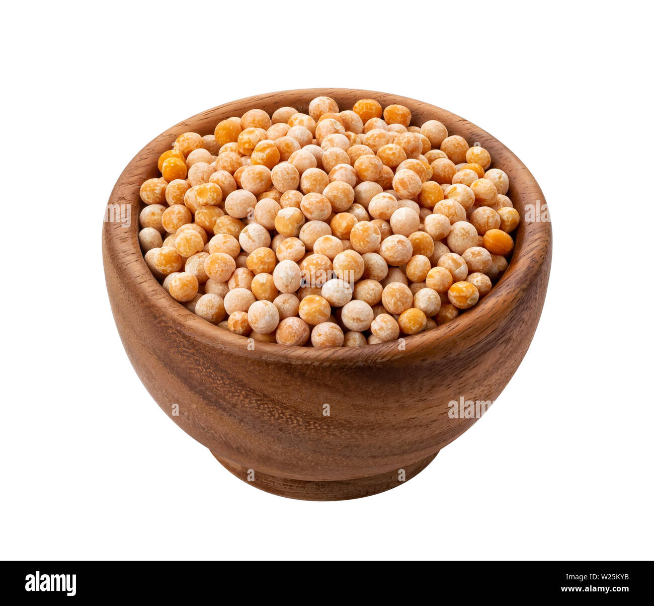 Brown wooden bowl with dried yellow pea Stock Photo