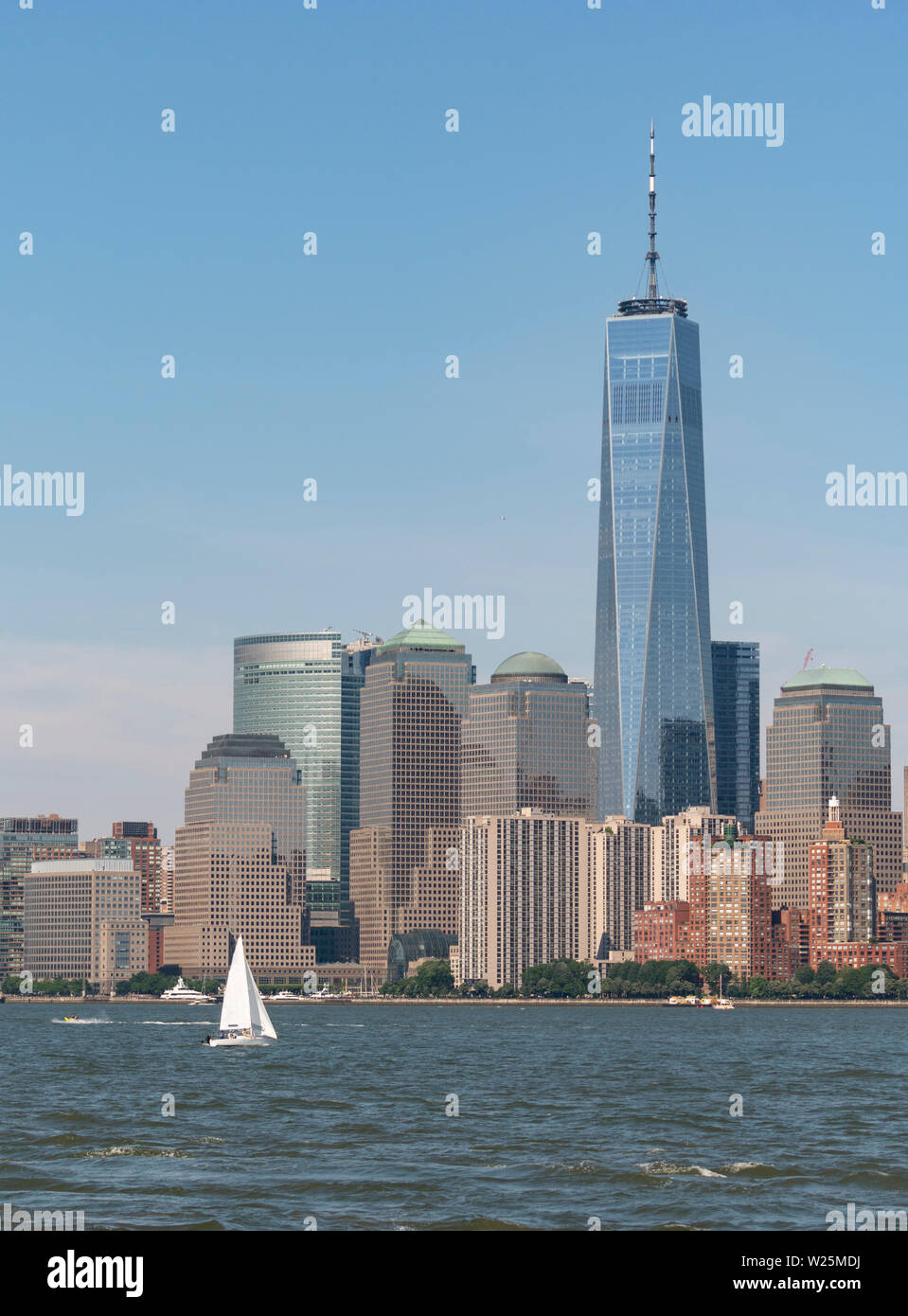 The Manhattan Skyline looms large on a beautiful summer holiday afternoon. Stock Photo