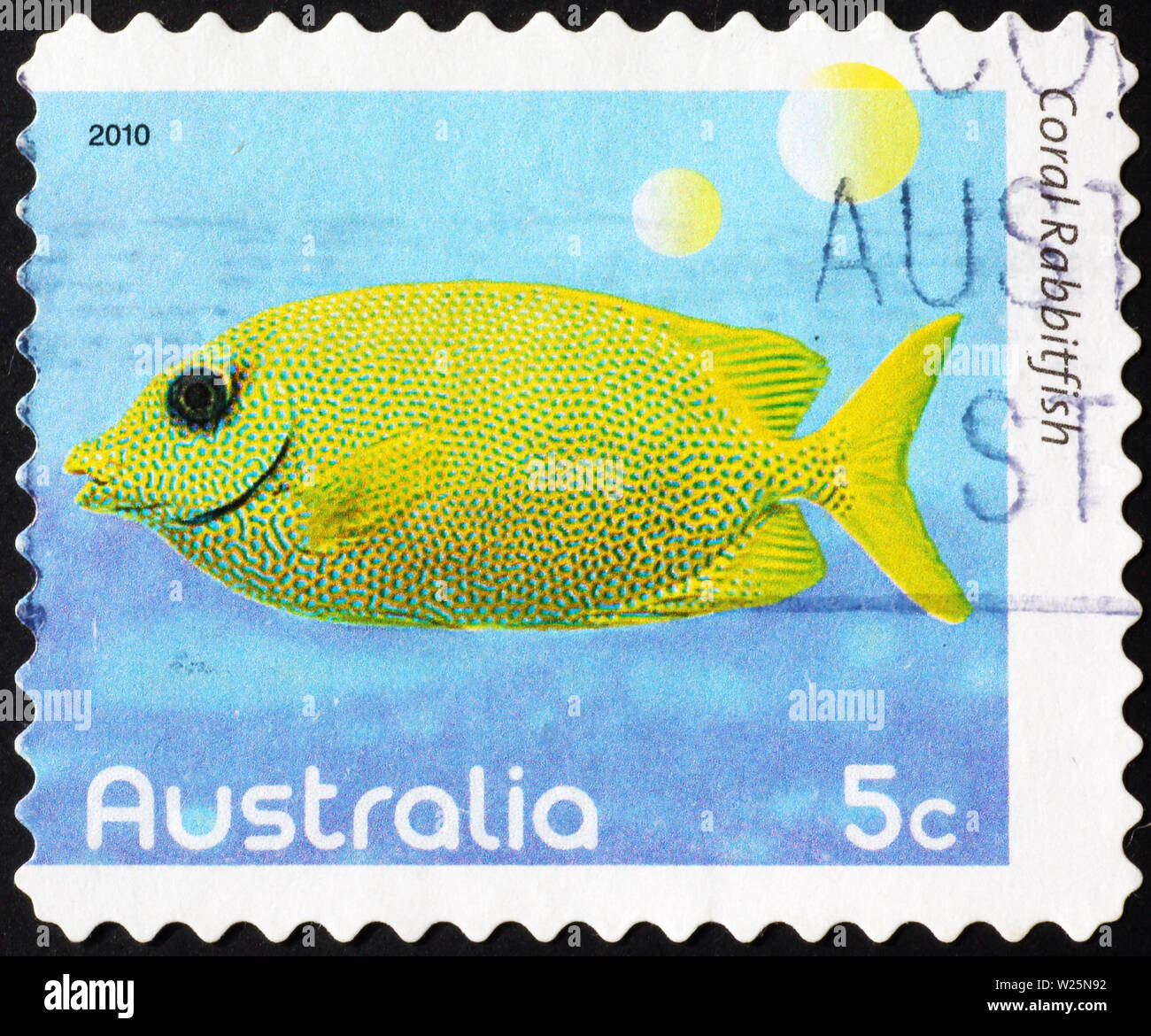 Tropical yellow fish on australian postage stamp Stock Photo