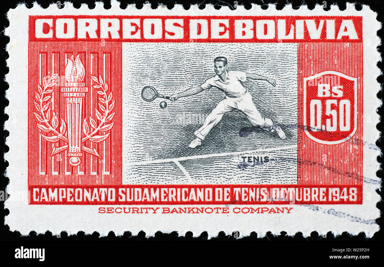 Tennis player on very old stamp of Bolivia Stock Photo