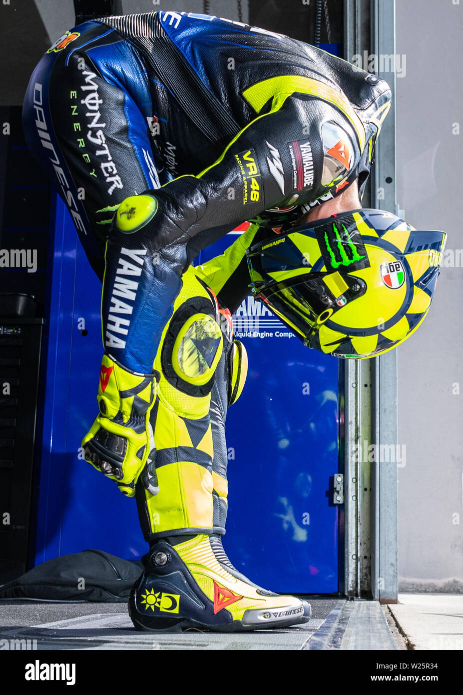 Hohenstein Ernstthal, Germany. . 06th July, 2019. Motorcycle, Grand Prix of  Germany, 3rd free practice MotoGP at the Sachsenring: Rider Valentino Rossi  (Italy, Monster Energy Yamaha MotoGP Team) stretches before leaving his