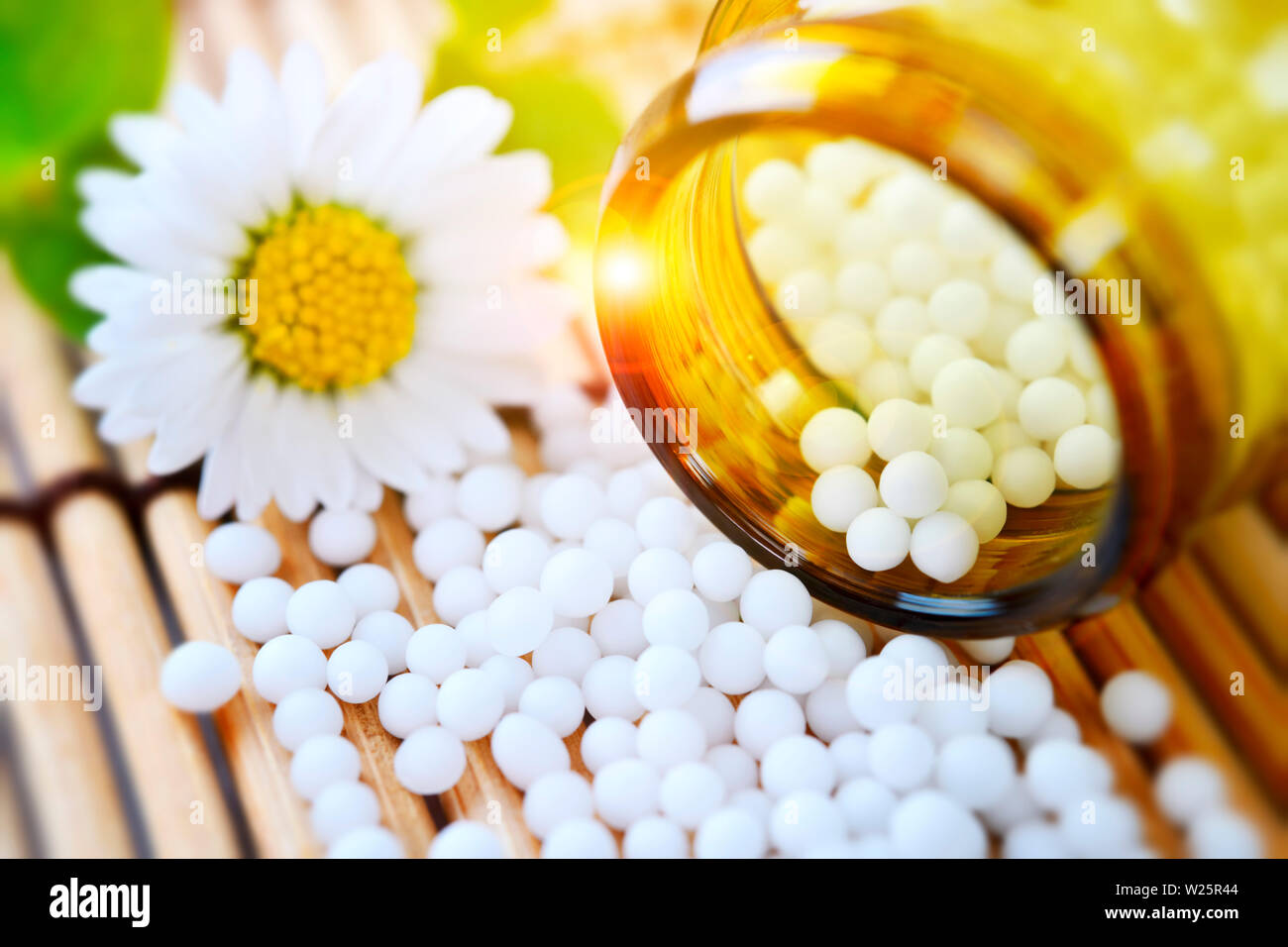 Globules and flower, homeopathic medicine Stock Photo