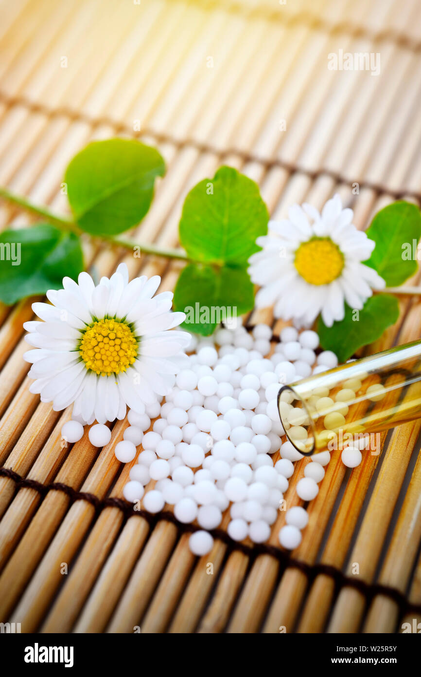 Globules and flower, homeopathic medicine Stock Photo