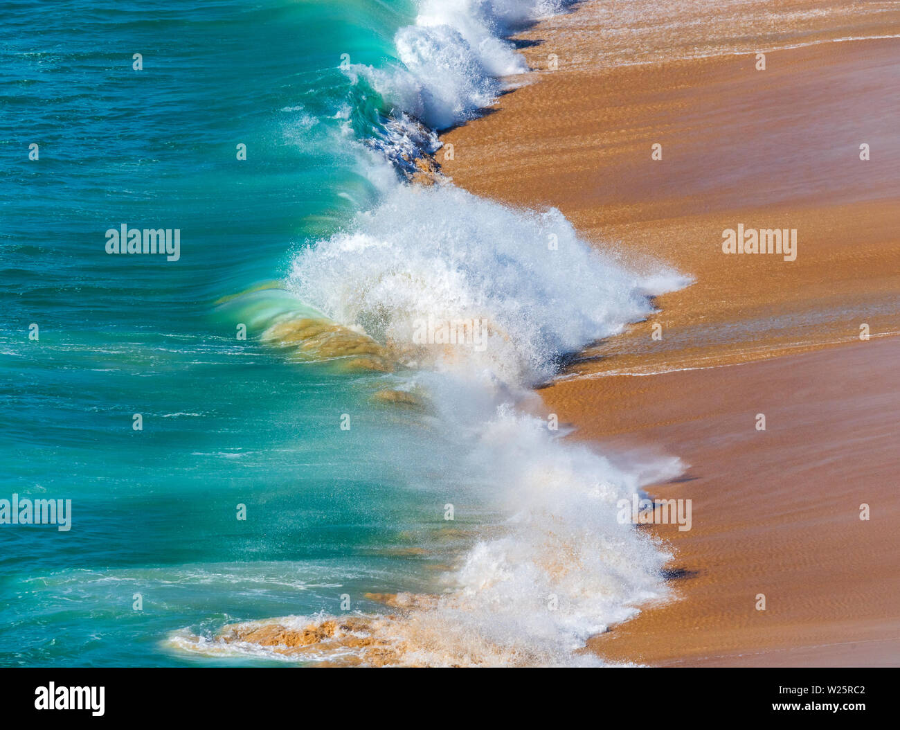 Soft blue ocean wave on sandy beach. Background. Stock Photo