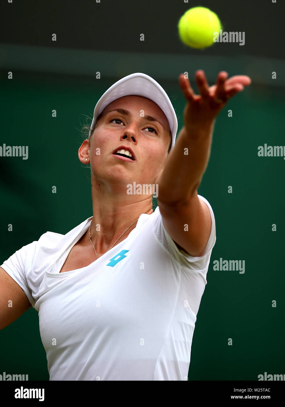 Elise Mertens in action against Qiang Wang on day six of the Wimbledon Championships at the All England Lawn Tennis and Croquet Club, Wimbledon. Stock Photo