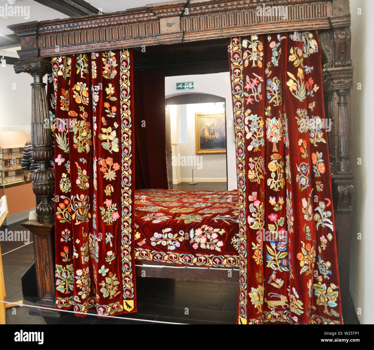 The Corbett Bed made from Carved Walnut at Shrewsbury Museum and Art Gallery, Shrewsbury, Shropshire, UK. The curtains were embroidered by volunteers. Stock Photo