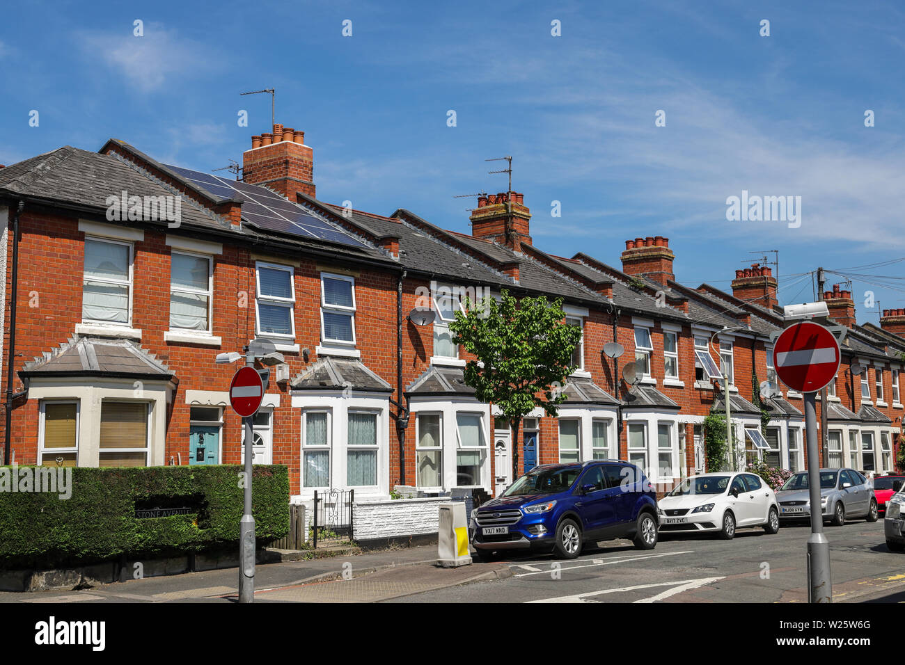One house with a solar panel in a row of Victorian terraced houses in Cheltenham UK Stock Photo