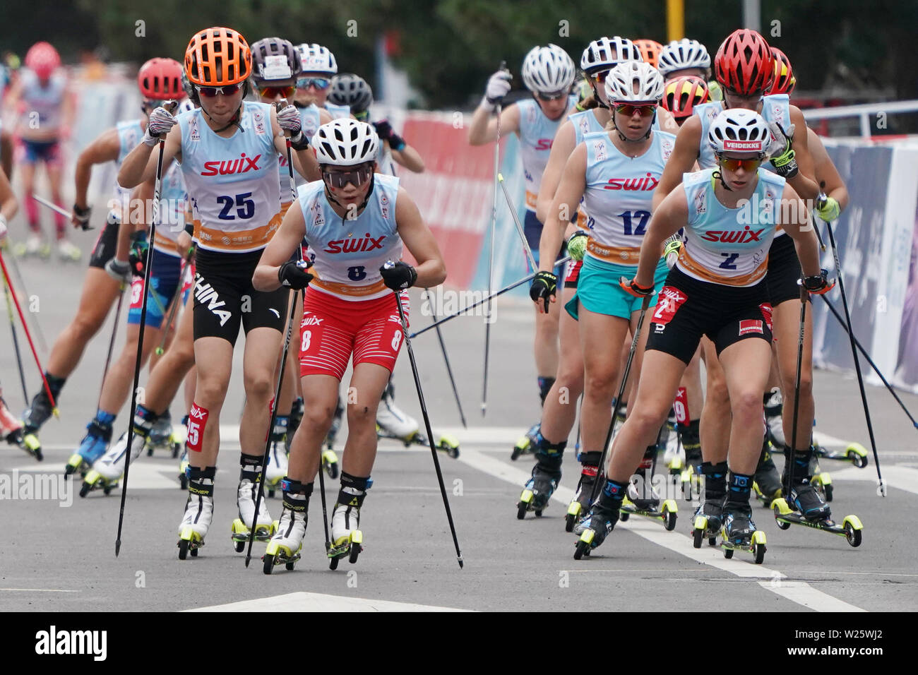 Beijing, China. 6th July, 2019. Anikken Gjerde Alnaes (2nd R) of Norway competes during the Women's 15.9km Mass Start of 2019 FIS China Beijing Roller Ski World Cup in Beijing, China on July 6, 2019. Credit: Ju Huanzong/Xinhua/Alamy Live News Stock Photo
