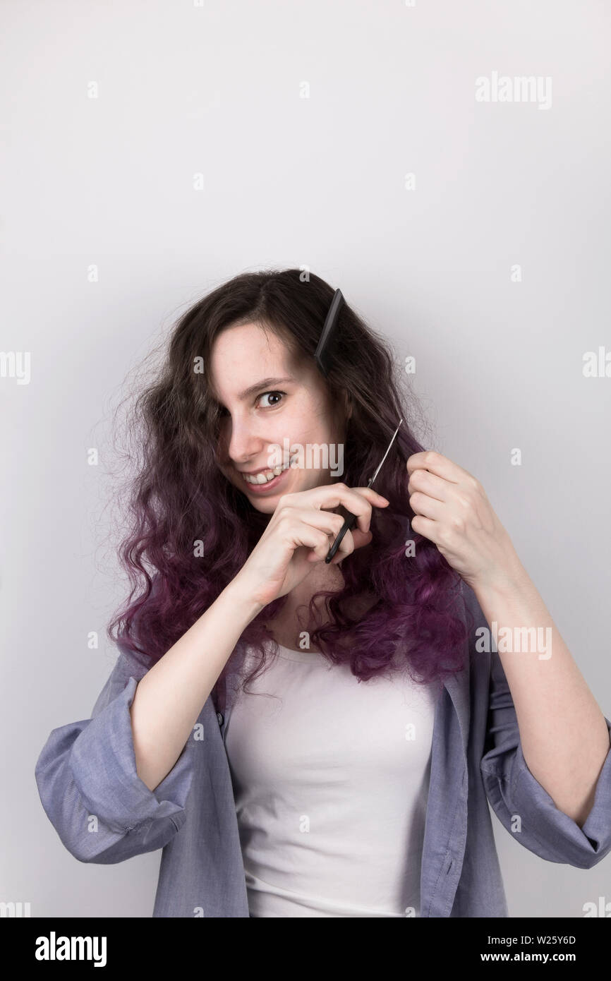 Young Girl Cuts To Herself Curly Purple Hair Gray Background