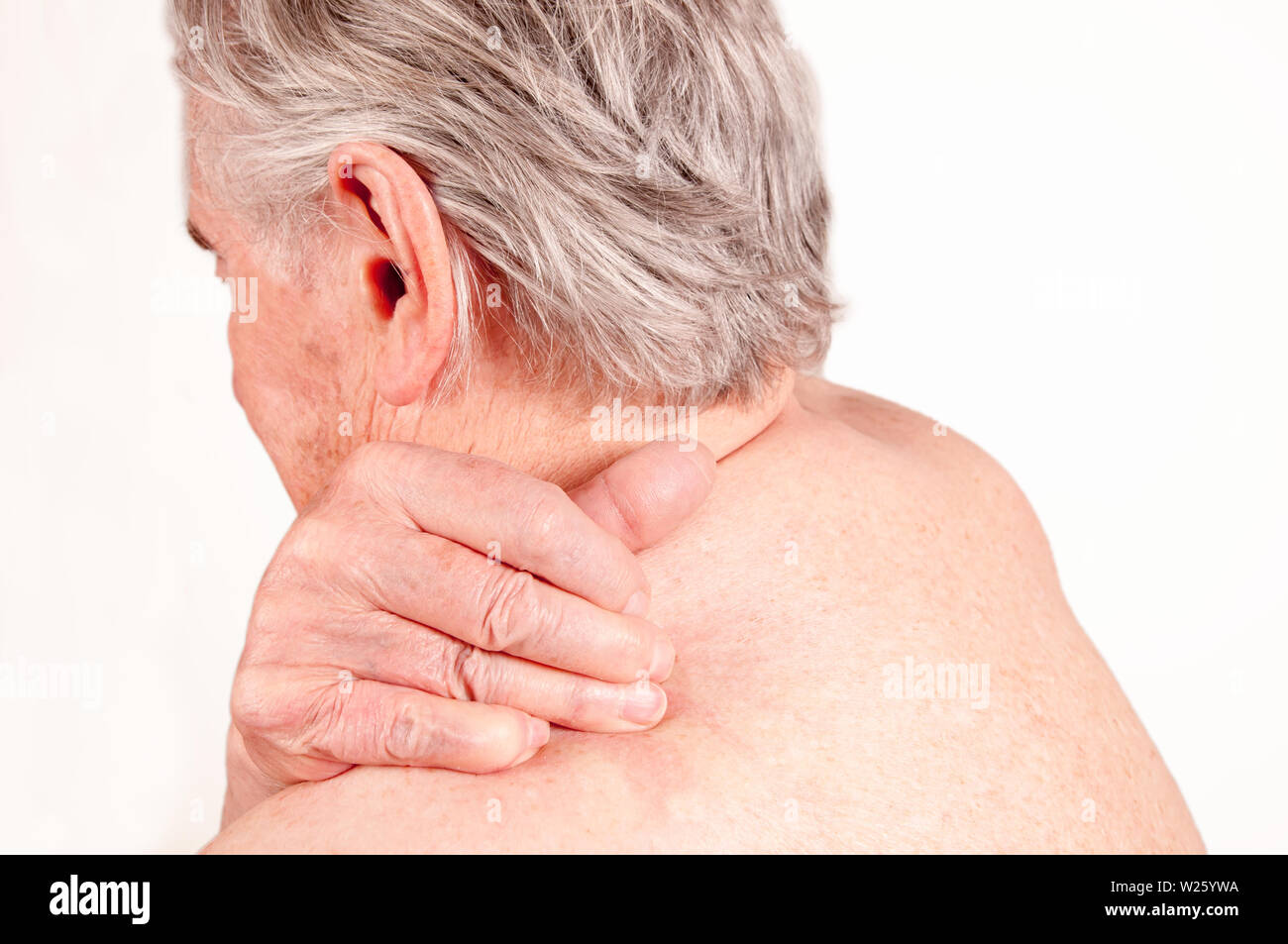 Senior with pain in the shoulder isolated on white Stock Photo