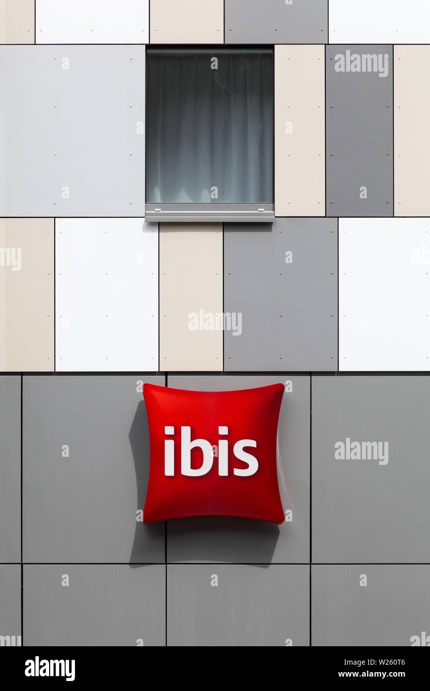 Esch sur Alzette, Luxembourg - July 12, 2015: Ibis hotel sign on a wall. Ibis is an international hotel company Stock Photo