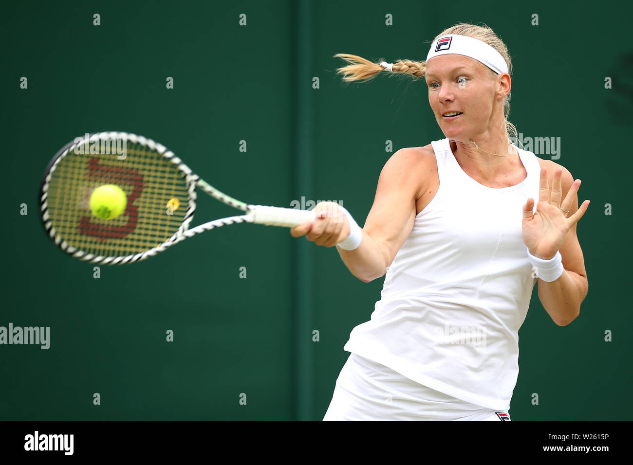 Kiki Bertens in action against Barbora Strycova (not pictured) on day six of the Wimbledon Championships at the All England Lawn Tennis and Croquet Club, Wimbledon. Stock Photo