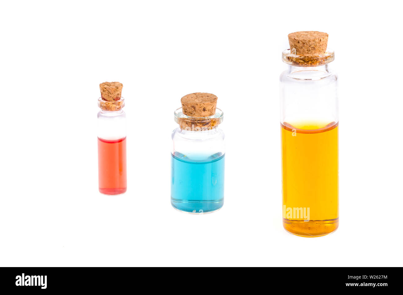 Glass medical bottles with colored liquid isolated on white Stock Photo