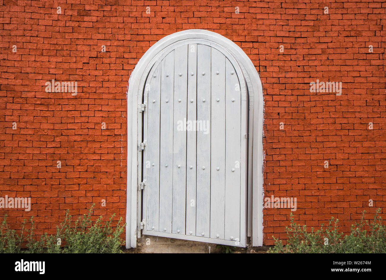 white vintage door on brick wall Stock Photo