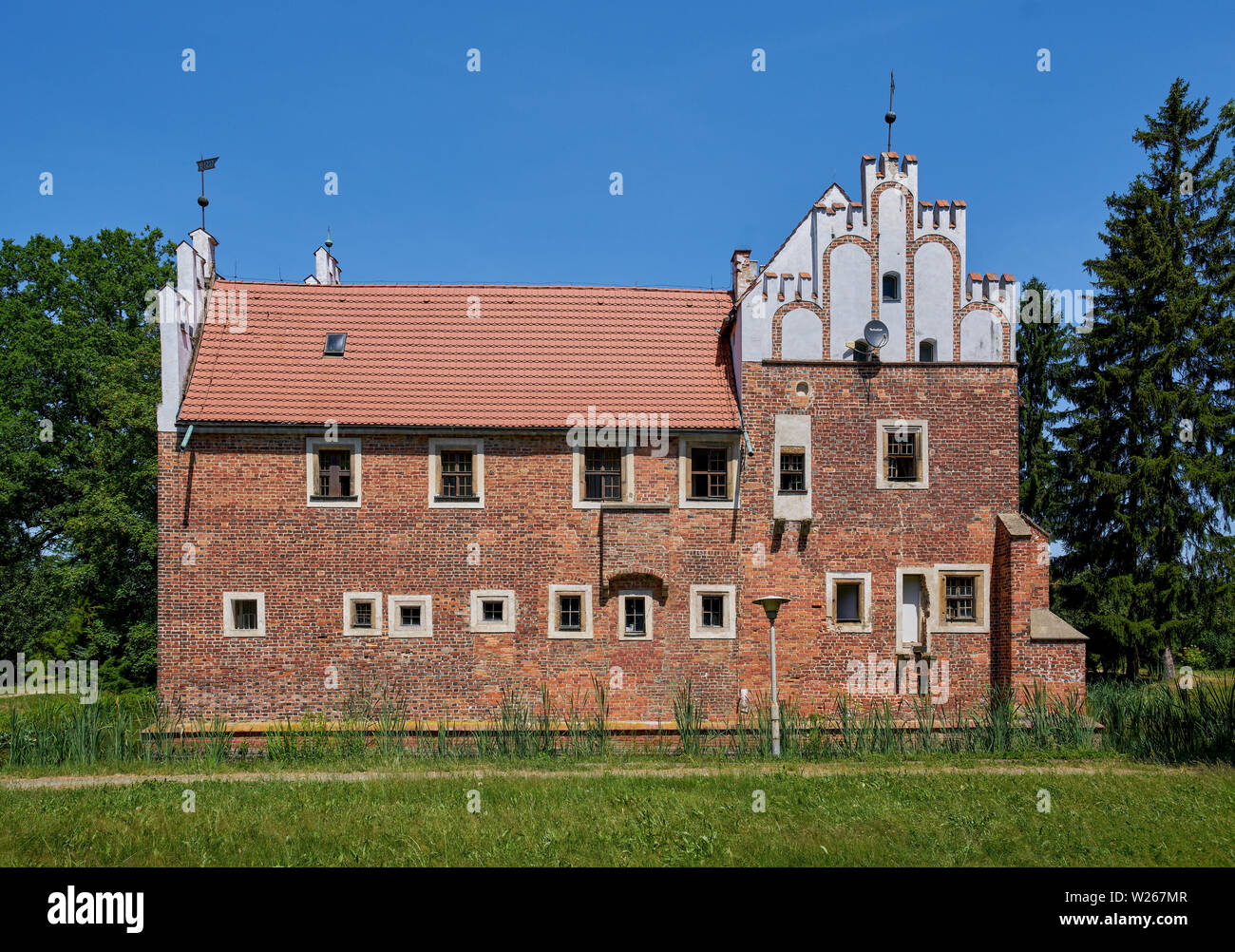 Gothic moated castle turned into the renaissance residence Wojnowice Lower Silesia Poland Stock Photo