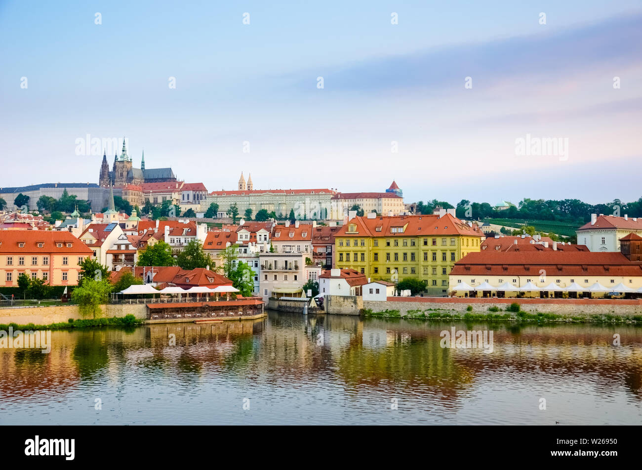 Amazing view of Prague Castle and historical old town taken with Vltava river. Sunrise light. Capital of Czech Republic. Beautiful skylines. Cityscape. Amazing cities. Bohemia, travel spot. Stock Photo
