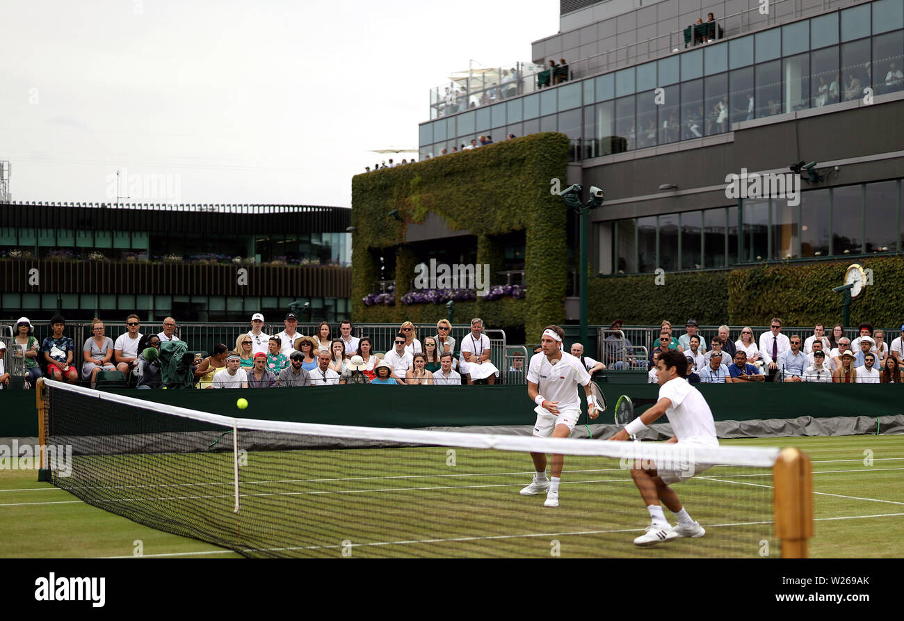 Cameron Norrie (left) and Jaume Munar during the gentlemen's doubles on day six of the Wimbledon Championships at the All England Lawn Tennis and Croquet Club, Wimbledon. Stock Photo