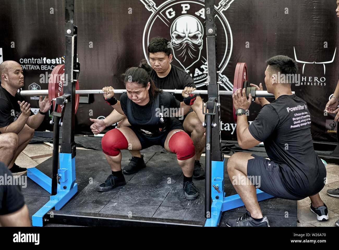 Power lifting female competitor participating in a weightlifting competition at Pattaya Thailand Southeast Asia Stock Photo