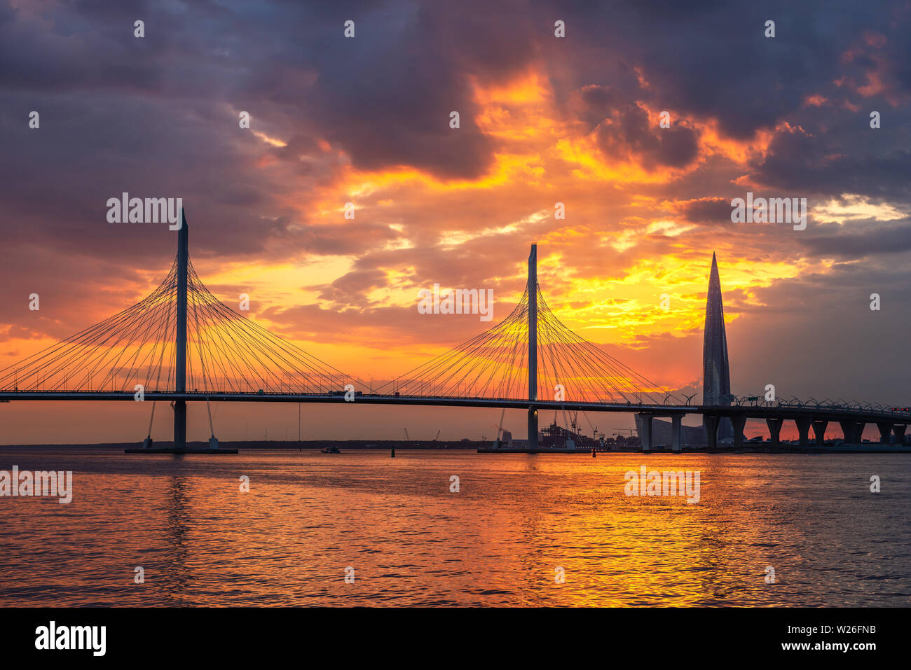 View of the cable-stayed bridge and the bay, in the distance the Lakhta Center building, the tallest building in Europe Stock Photo