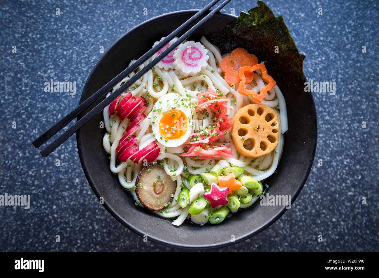 Bowl of Japanese buckwheat ramen noodle soup topped with the number