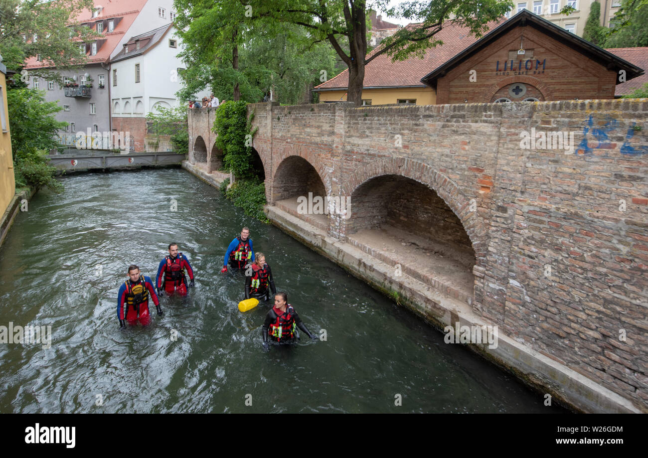 Augsburg, Germany. 06th July, 2019. Passersby walk along one of the