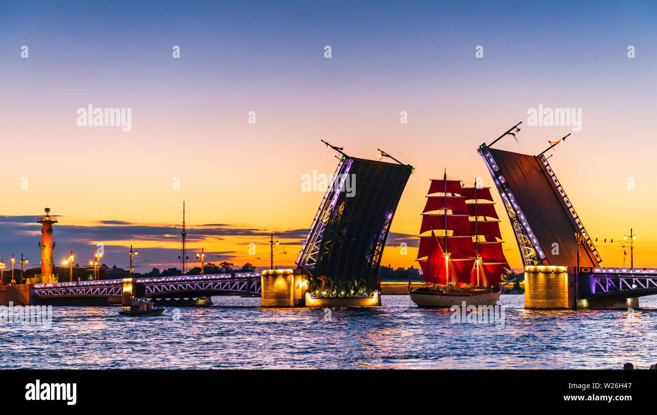 Ship with red sails sails on the Neva. Preparation for the holiday of all schoolchildren "Scarlet Sails" in Saint Petersburg Stock Photo