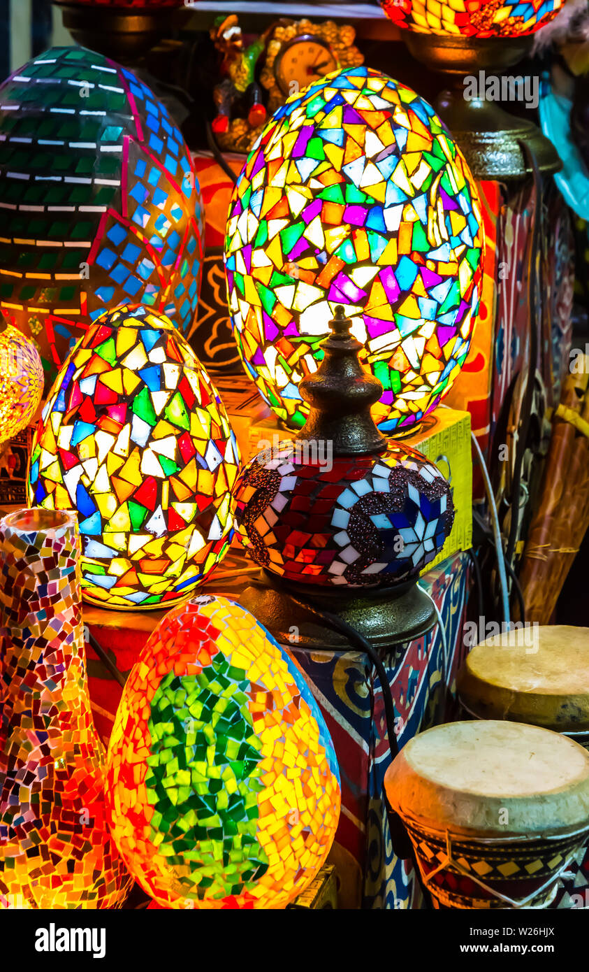 Colorful scattered-mosaic lamps on display with oriental tablas ( drums, darbula), in El Muez (Muizz, Moez) Street in Khan El Khalili, Al Shaaban Baza Stock Photo