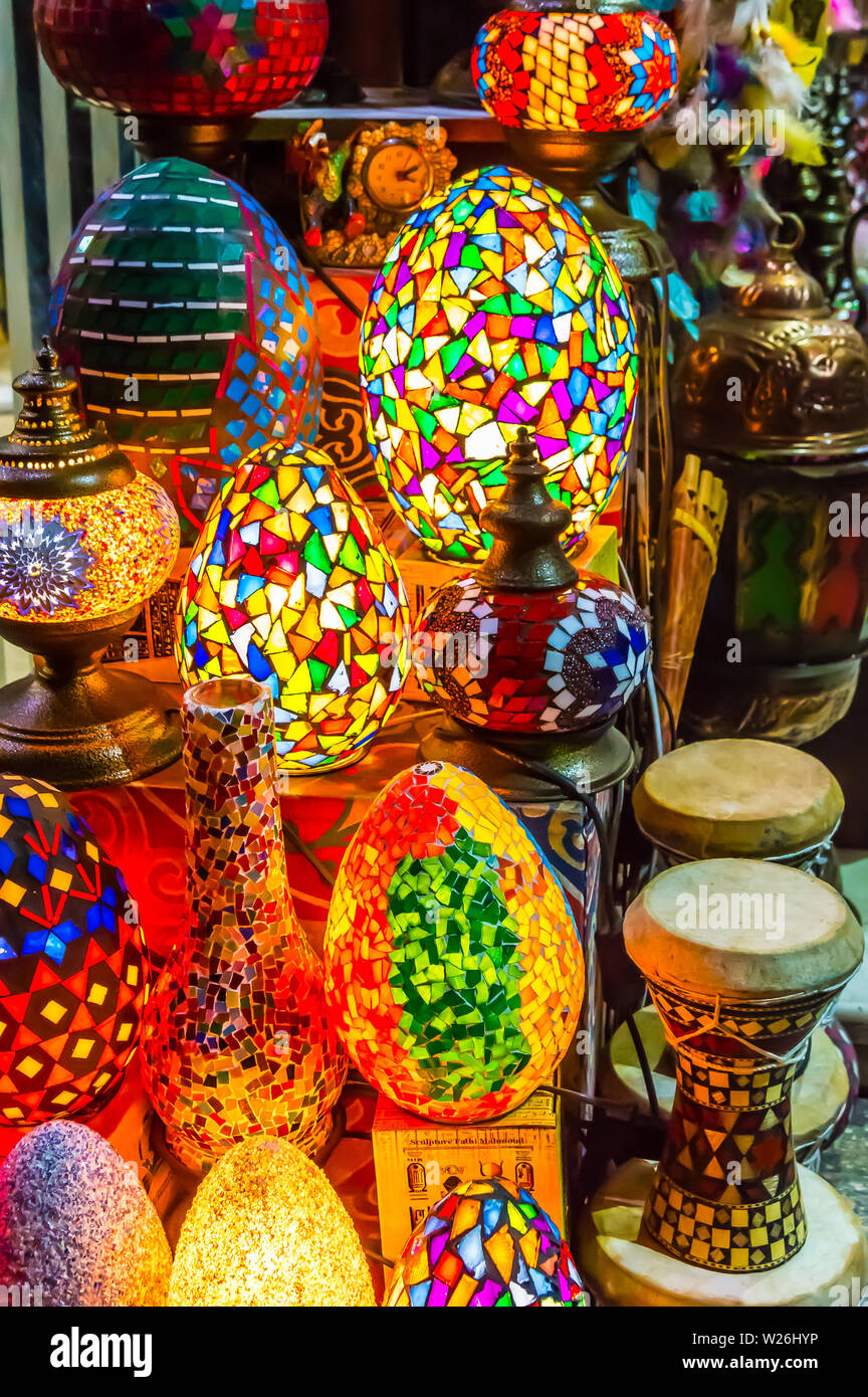 Colorful scattered-mosaic lamps on display with oriental tablas ( drums, darbula), in El Muez (Muizz, Moez) Street in Khan El Khalili, Al Shaaban Baza Stock Photo