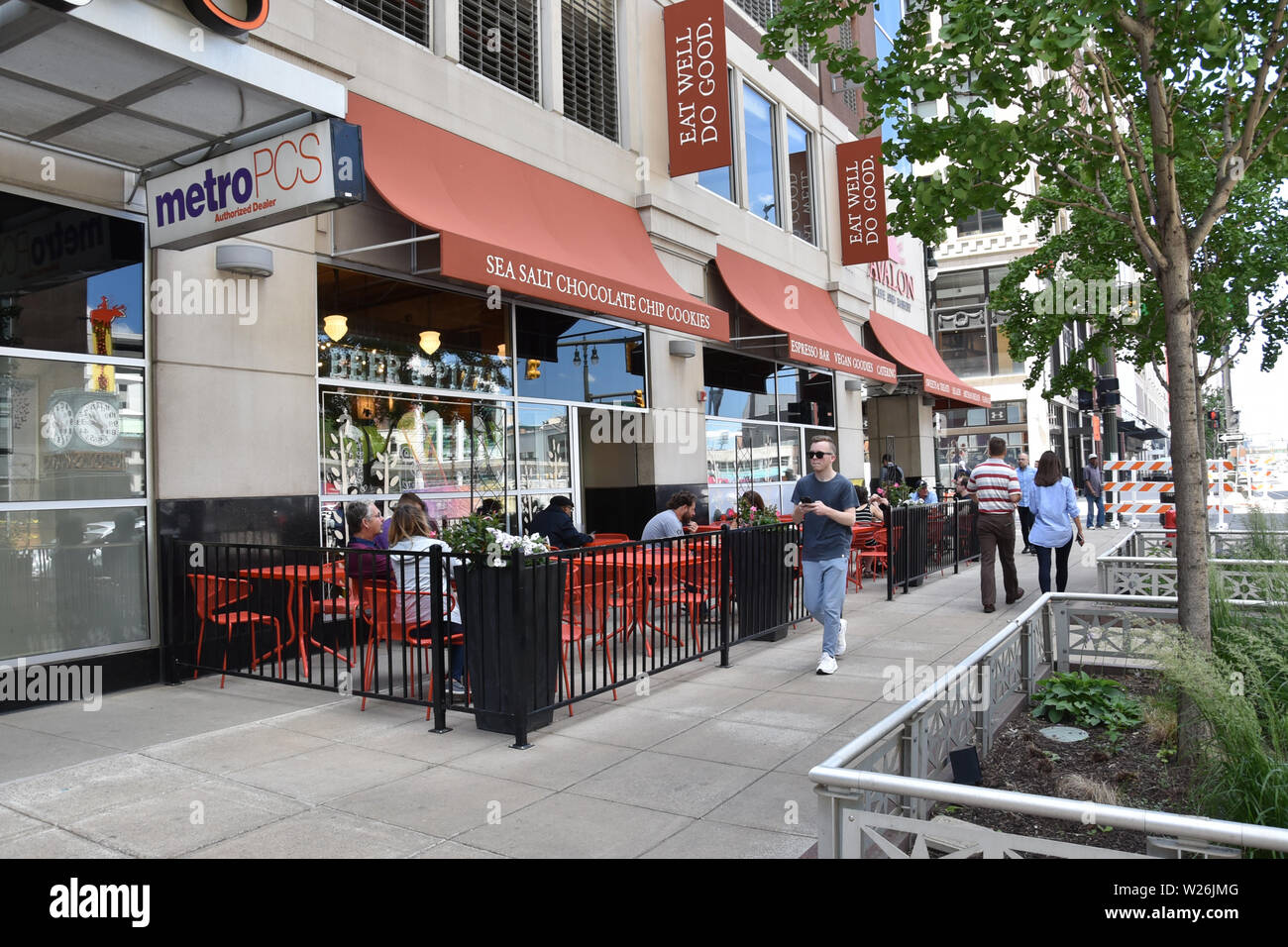 DETROIT, MI / USA - JUNE 30, 2019:  People walking by the Avalon restaurant in downtown Detroit. Stock Photo