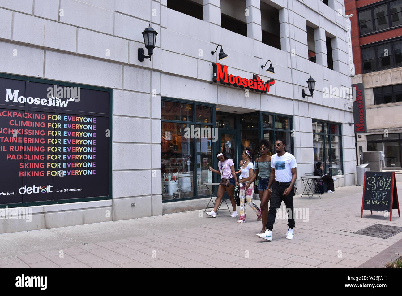 DETROIT, MI / USA - JUNE 30, 2019:  People walk past the Moosejaw store in downtown Detroit Stock Photo