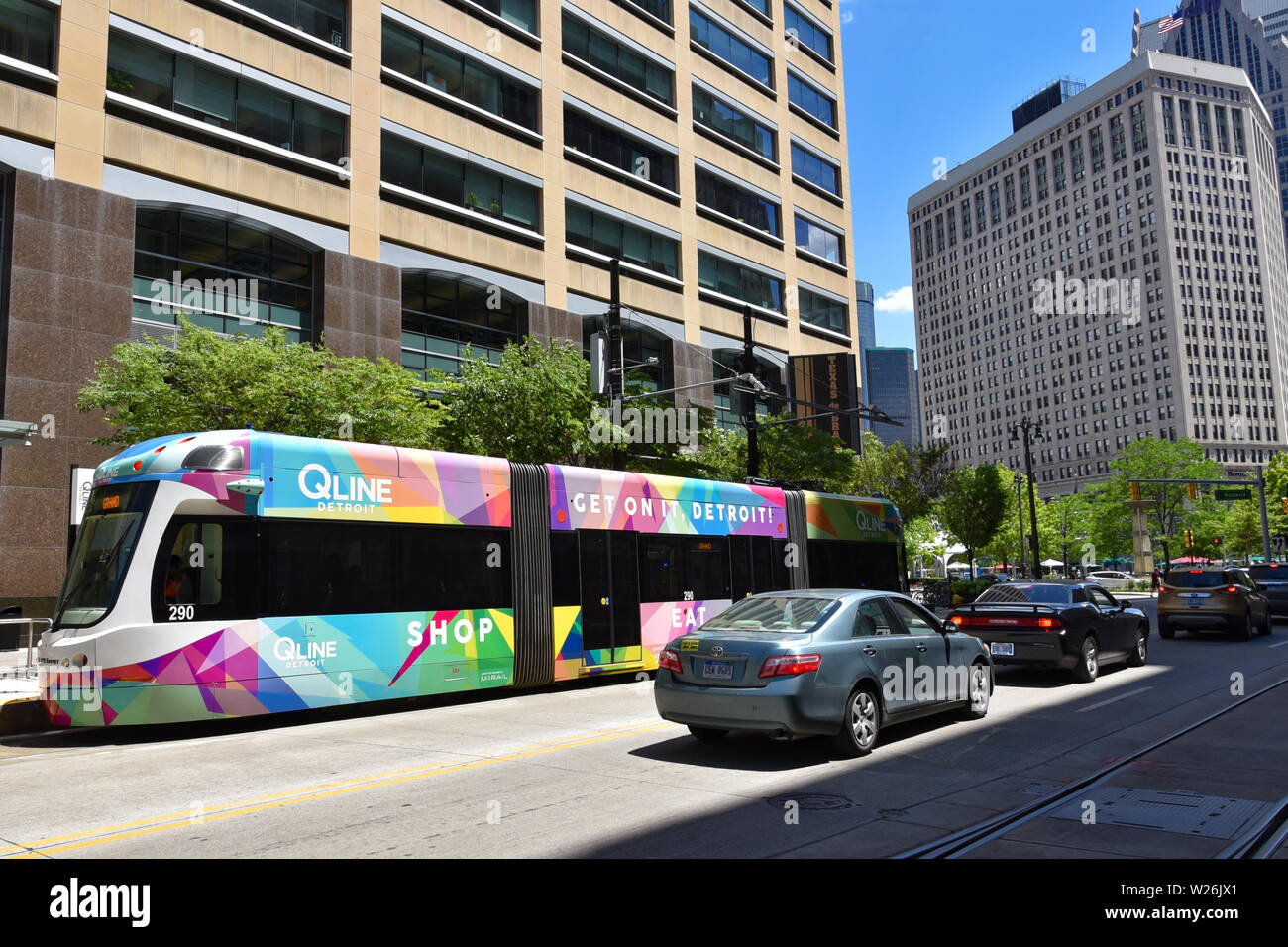 DETROIT, MI / USA - JUNE 30, 2019:  QLine buses, such as the one shown here, travel along Woodward Avenue in downtown Detroit. Stock Photo