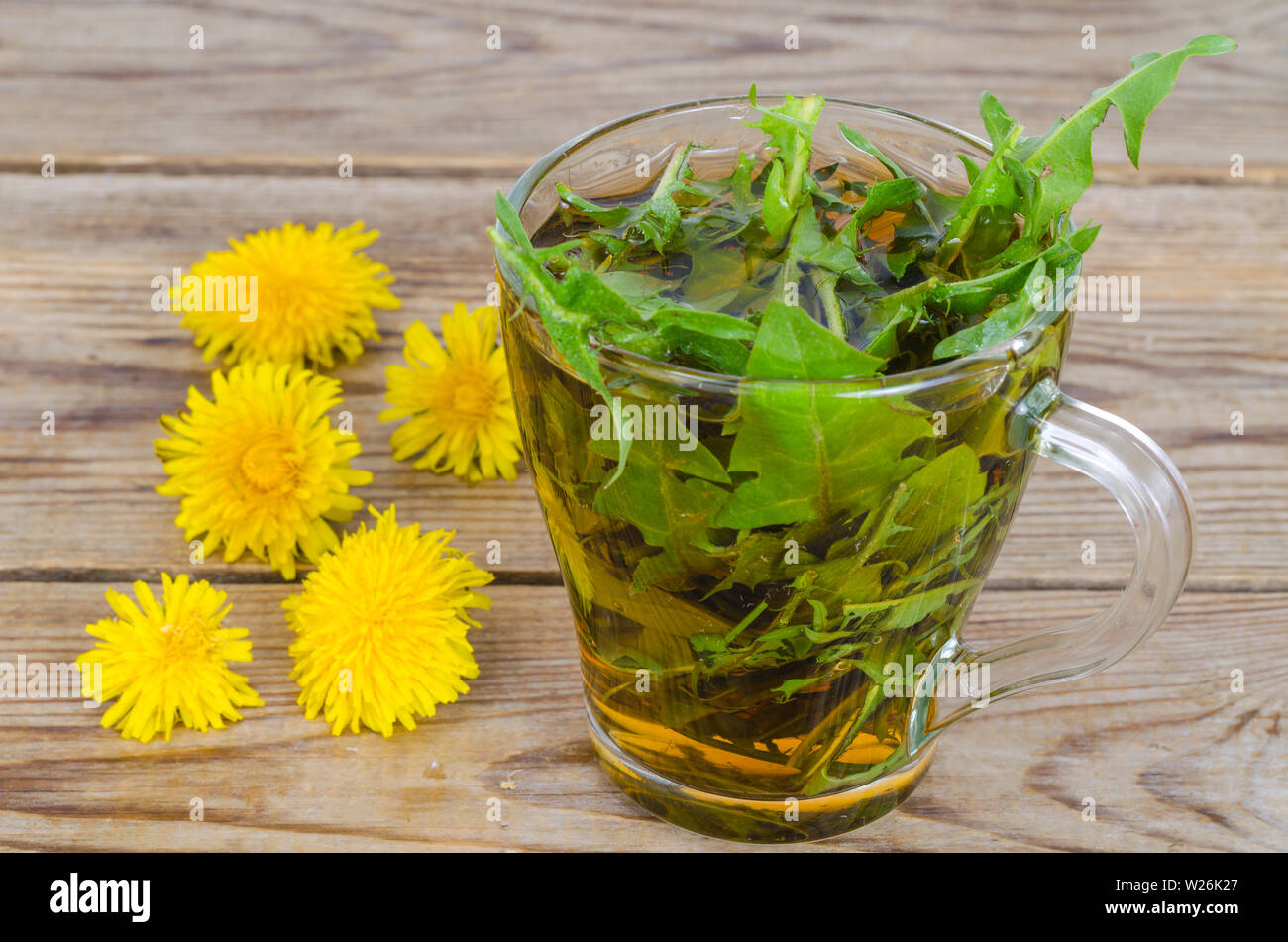 Cup of tea from fresh dandelion leaves Stock Photo - Alamy