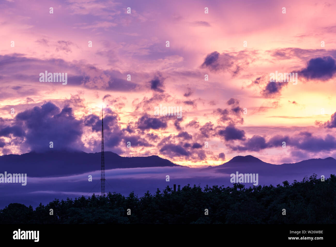 Swilight sunset sky clouds with forest Stock Photo