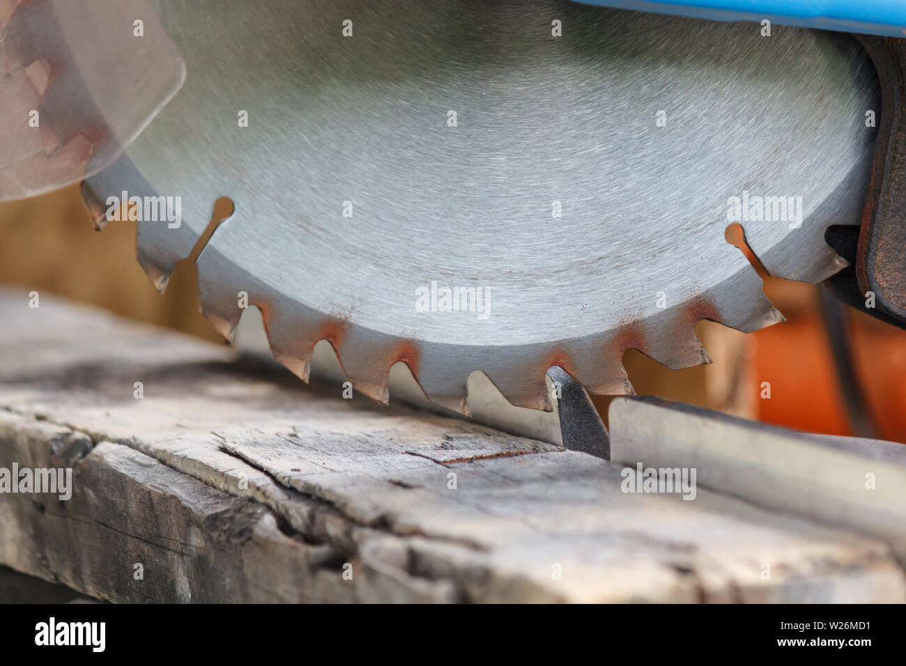 Old timber strip with teeth circular saw in workshop Stock Photo