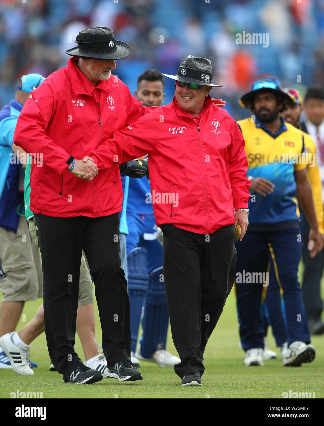 Umpire Paul Wilson (left) shakes hands with Ian Gould who had officiated his last match during
