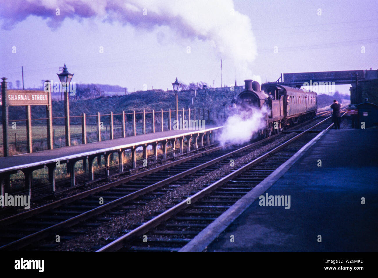 Sharnal Street station, Kent. Image taken 2 days before its closure to passengers on 4th December 1961 with the following year closure to freight on 20 August 1962. The railway was part of the Hundred of Hoo and ran between High Halstow Halt and Beluncle Halt. The small station originally had just one platform with a second one added in 1935 The station buildings were demolished in 1967 Some of the sidings can still be seen near Medway Power Station. Stock Photo