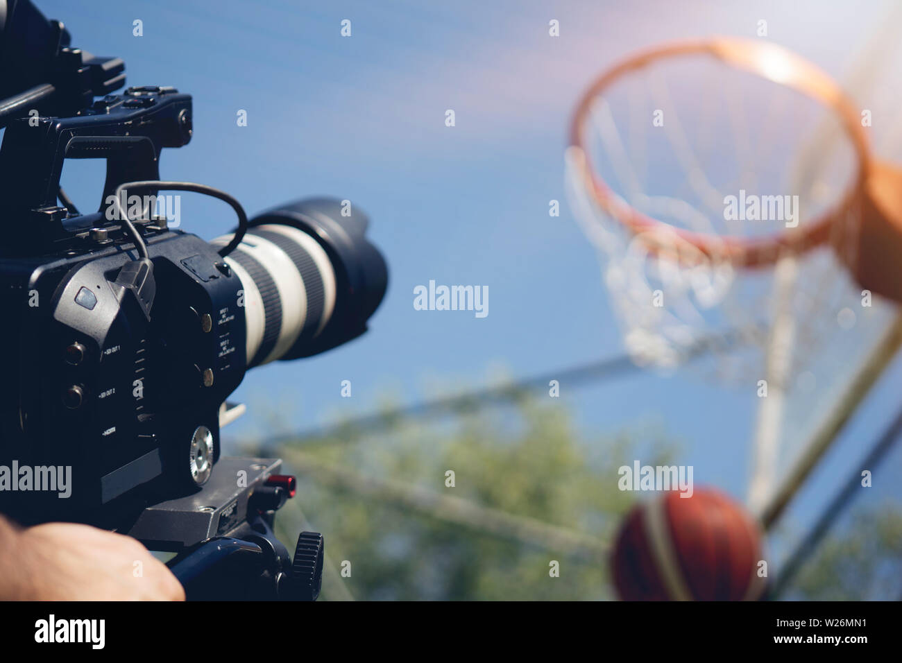 Blurry image of movie shooting or video production and film crew team