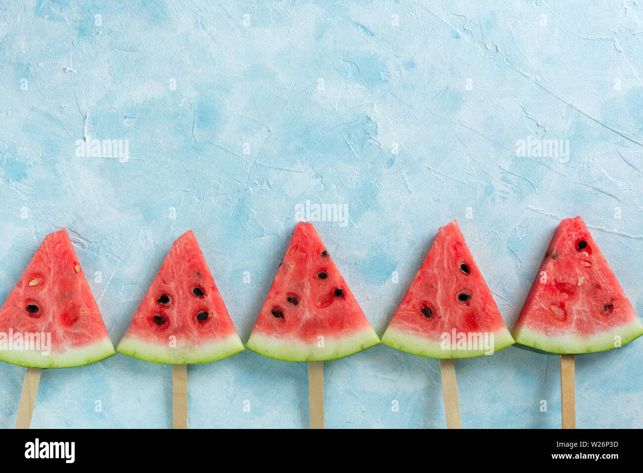Fruit ice cream sliced watermelon on pastel blue background Stock Photo ...